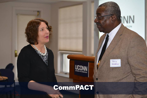 michele femc-bagwell speaking with male attending commpact event