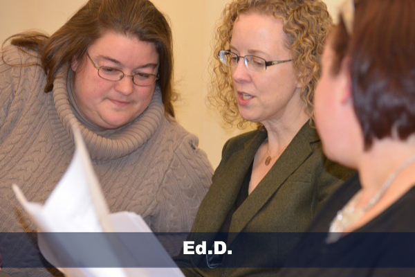 jen michno and ann traynor looking at papers during edd class